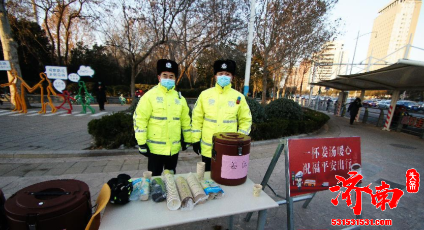 济南历下交警在路口为过往行人派发姜茶 让市民感受到了家人般的温暖和安全